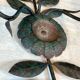 Pair of decorative wall sconces with sunflowers and patinated metal foliage.
