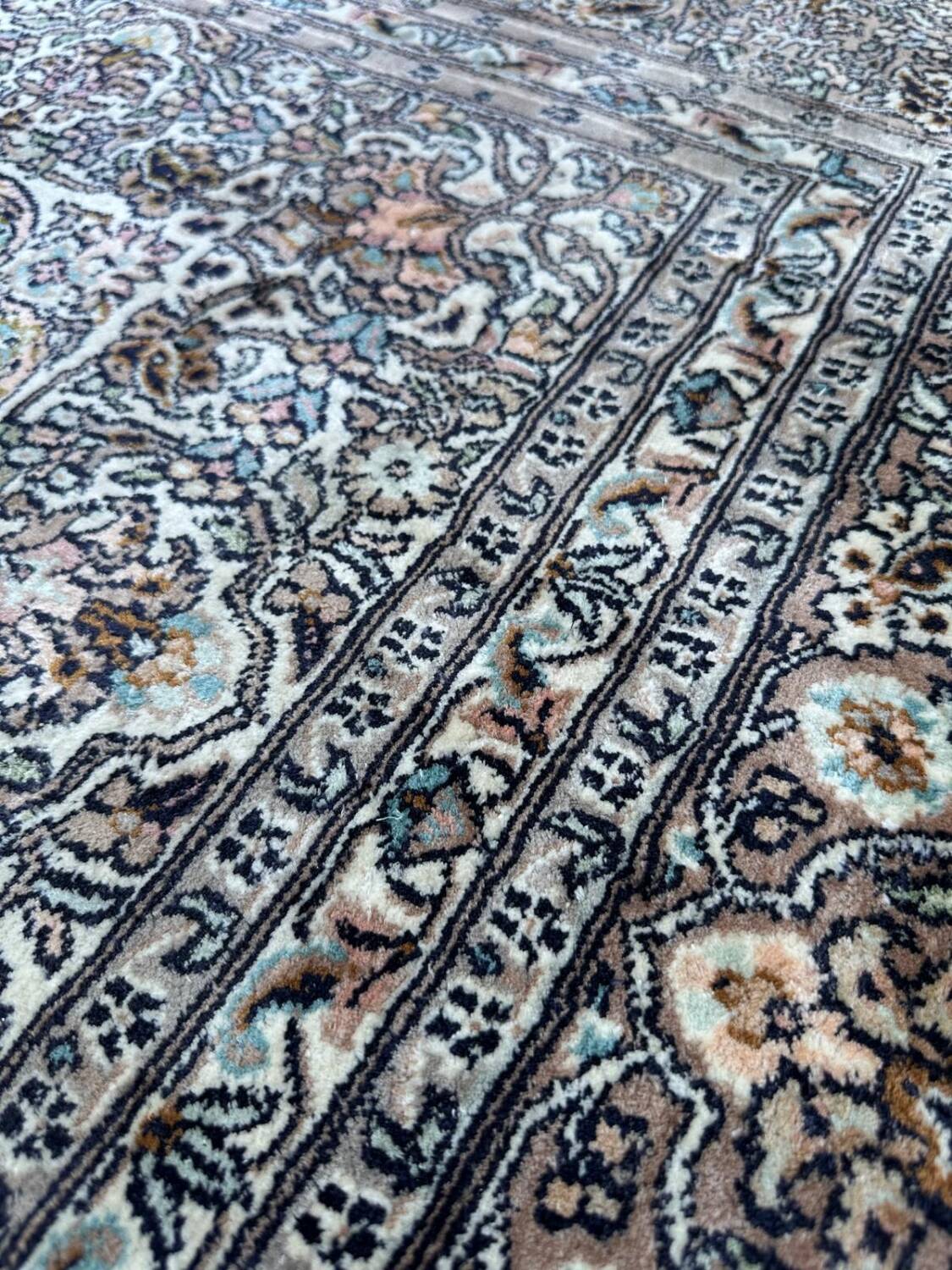 Hand-knotted Persian silk rug