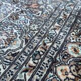 Hand-knotted Persian silk rug