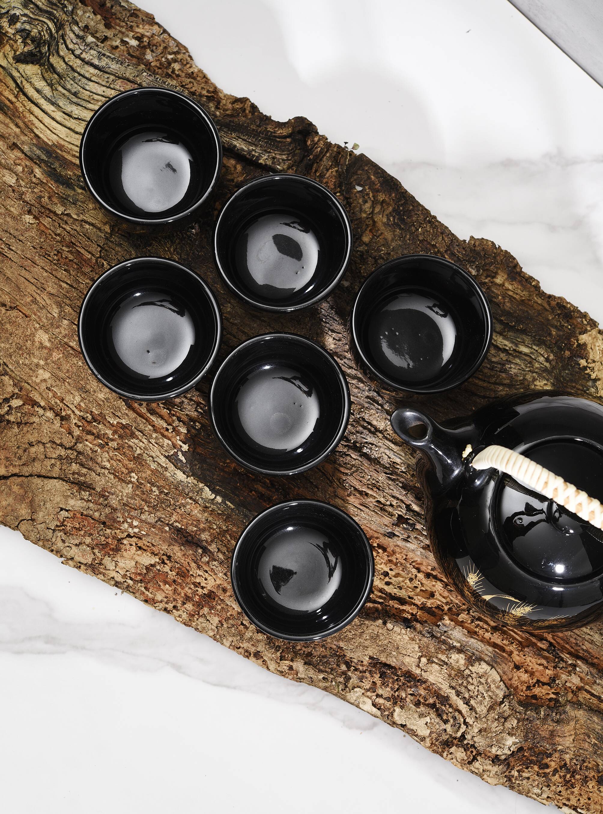 Japanese tea service, teapot and 6 cups, black, gold pattern.