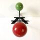 Small double coat hook in metal and wood painted green and red, 1950s-60s