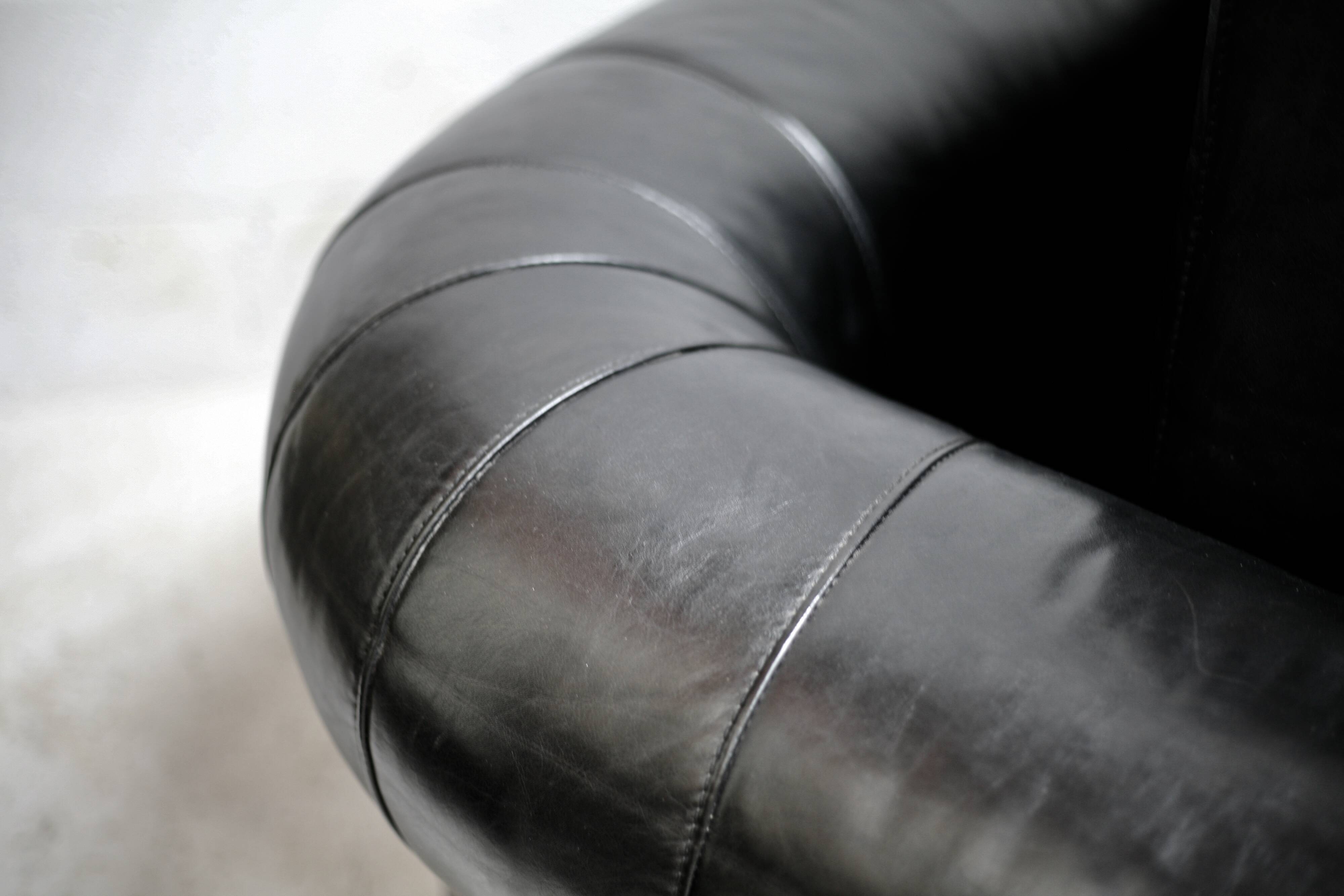 Large black leather armchair, France, 1980s