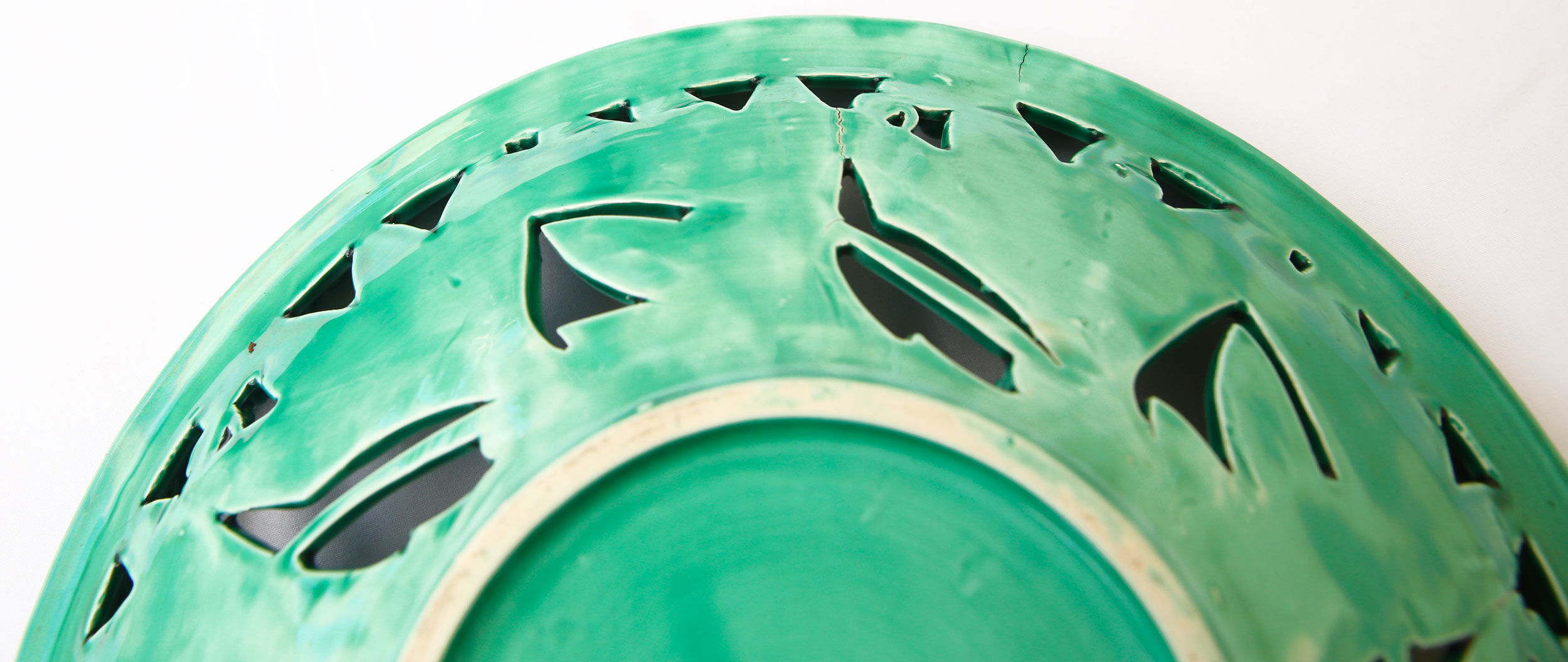 Openwork XL dish in green slurry like olive branches