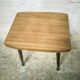 Side table with compass legs