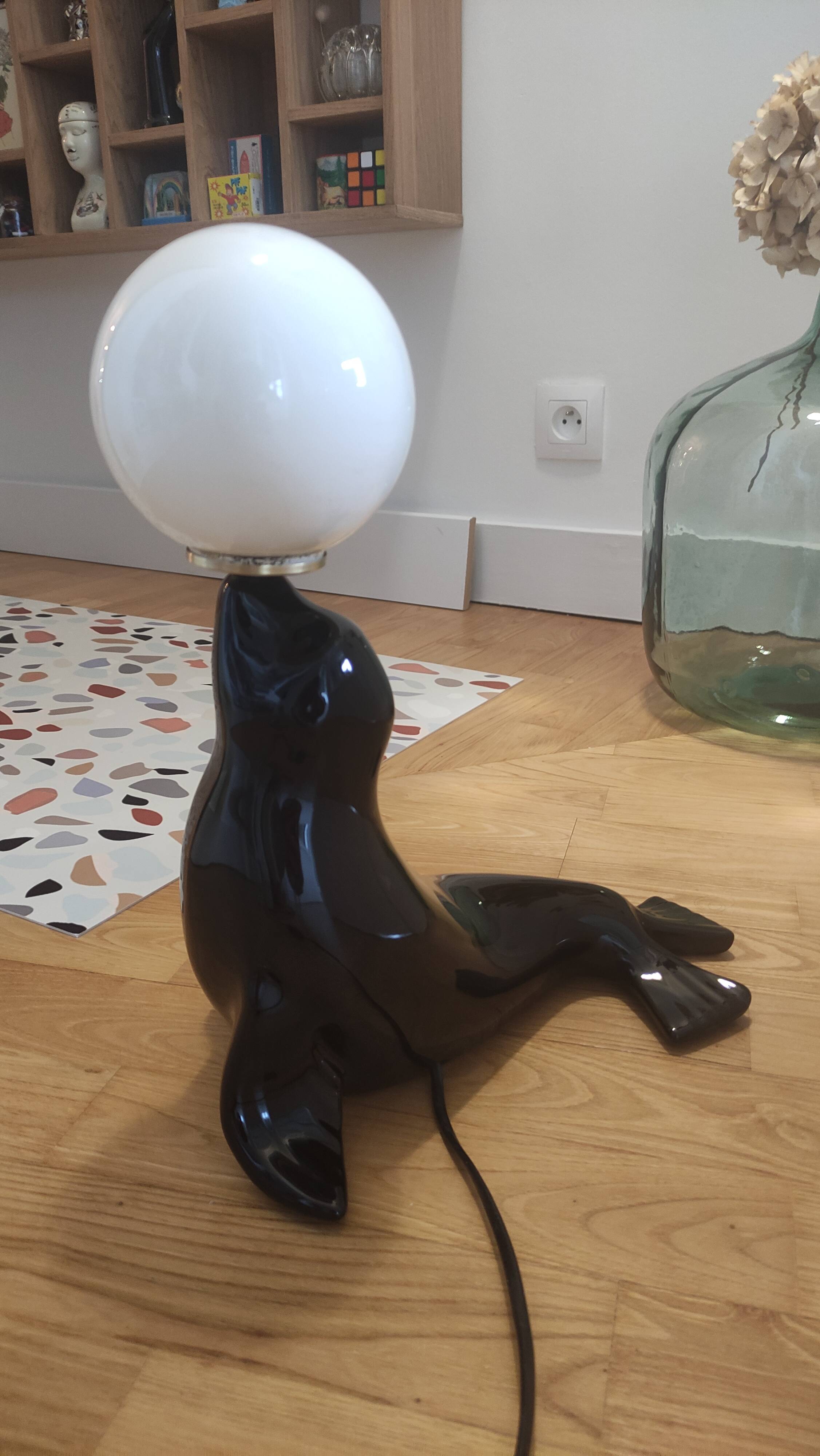Vintage black sea lion lamp