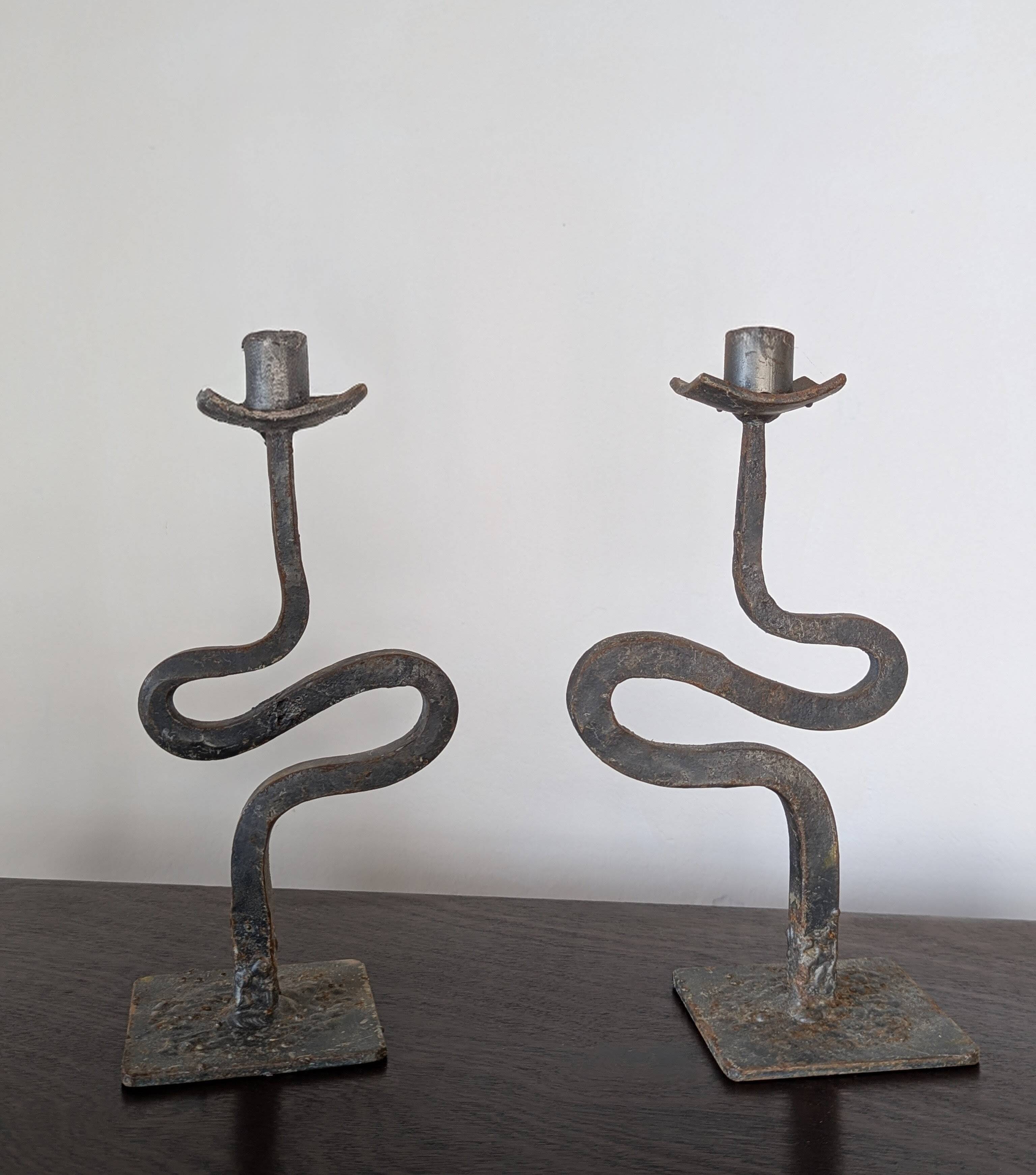 Pair of wrought iron candlesticks