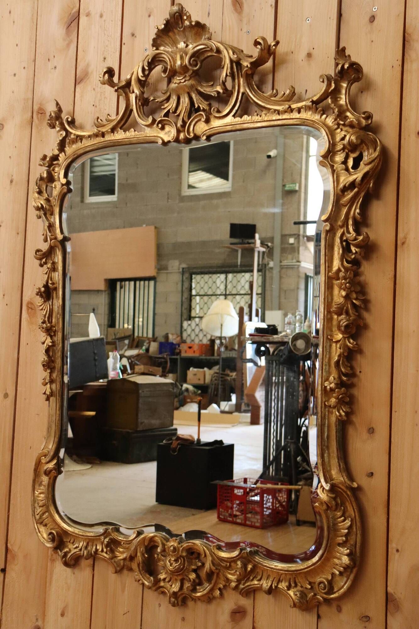 Golden wooden mirror in Louis XV style