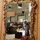 Golden wooden mirror in Louis XV style
