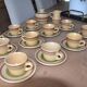 11 St Amand glazed stoneware cups and saucers/sugar bowl/milk jug