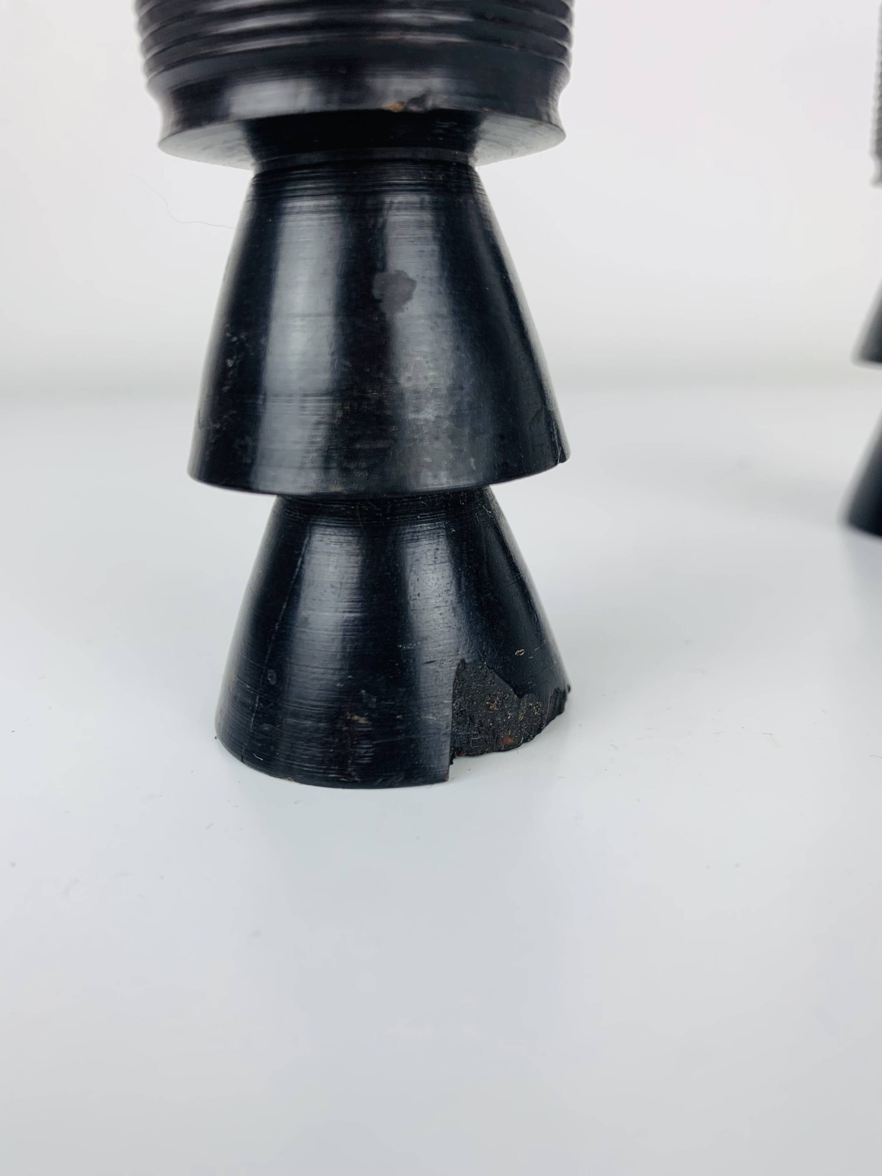 Pair of vintage ethnic blackened wood candlesticks