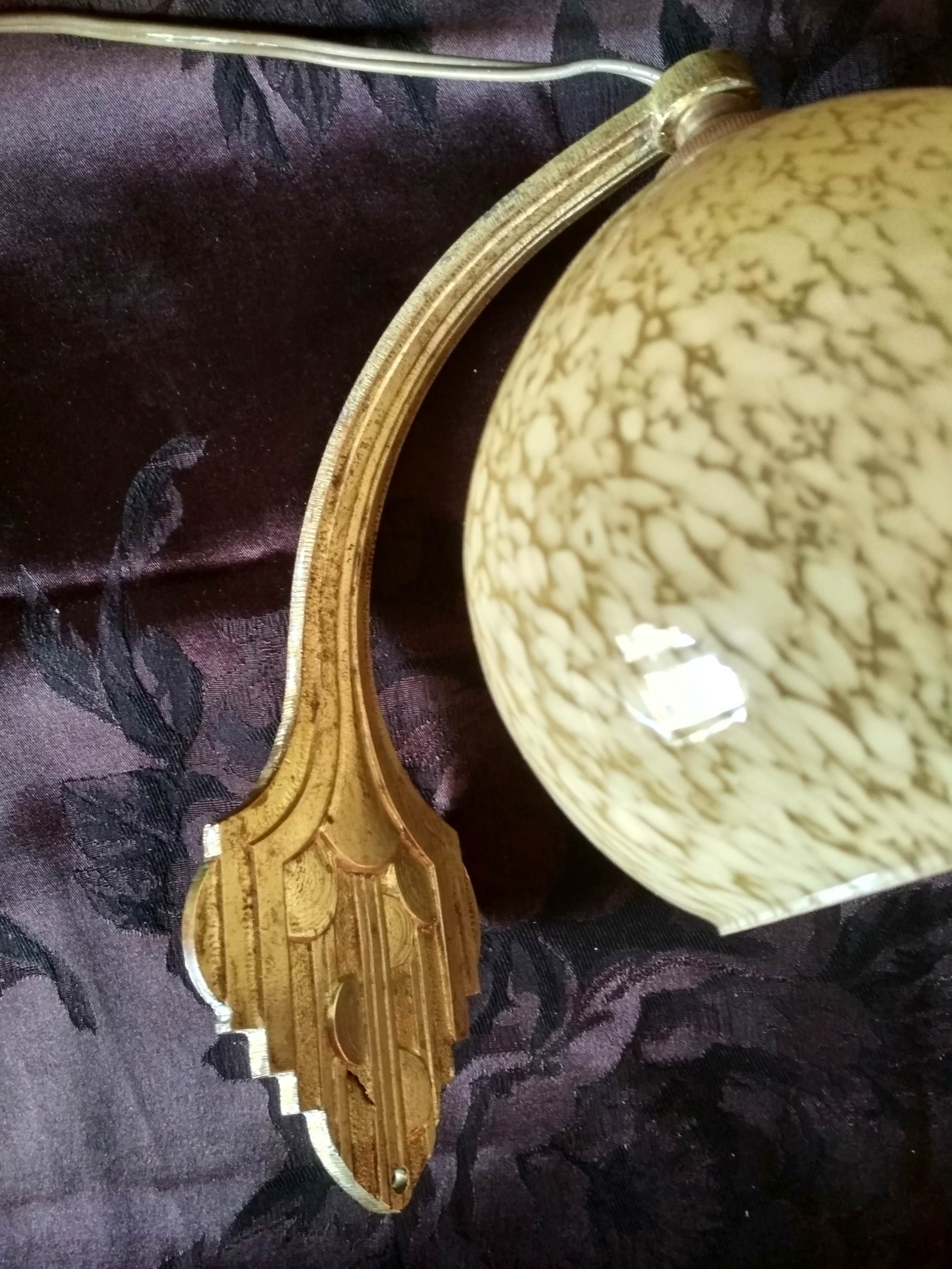 Art deco sconce, golden brass and yellow speckled Clichy glass globe