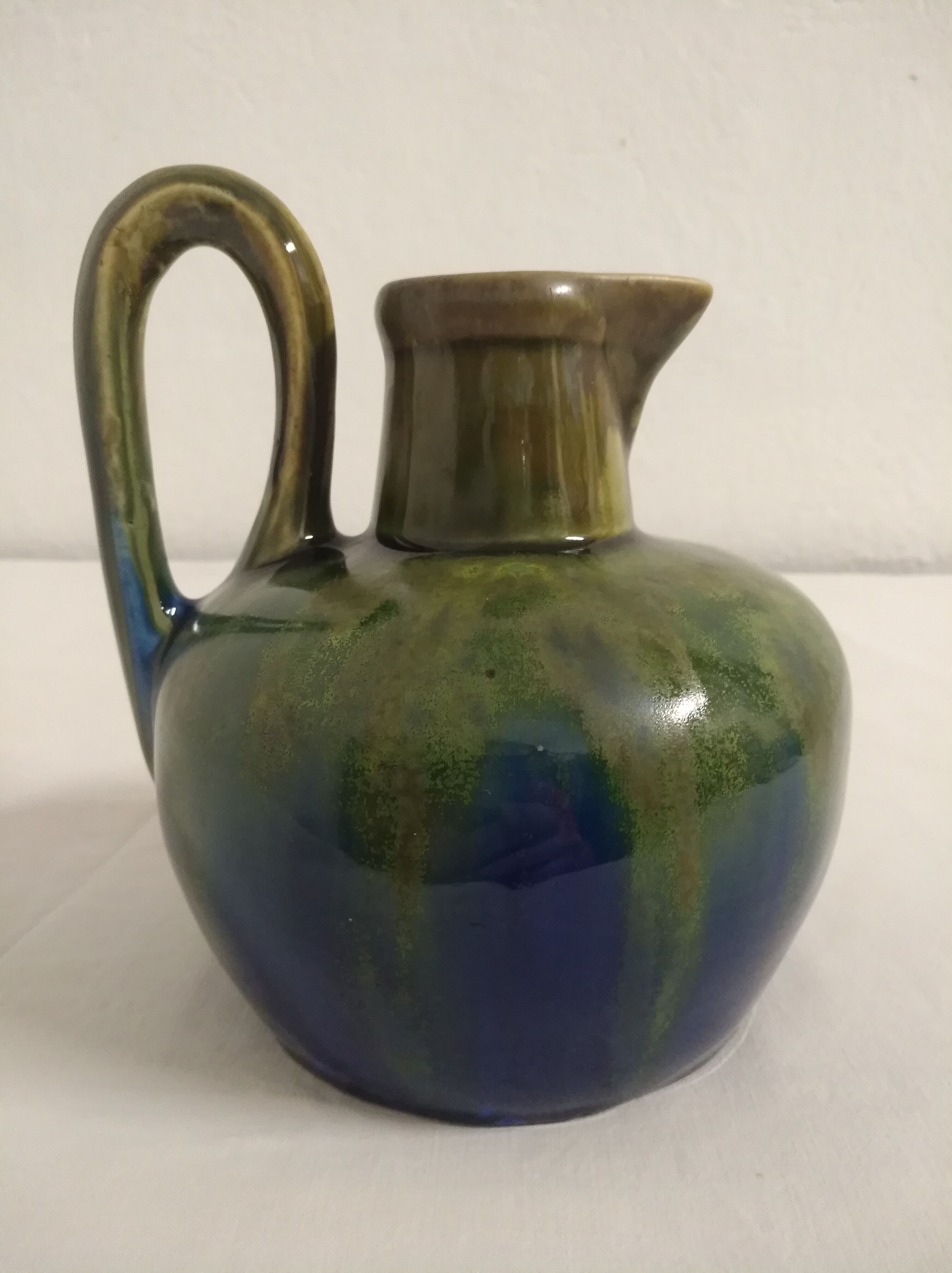 Flamed ceramic pitcher
