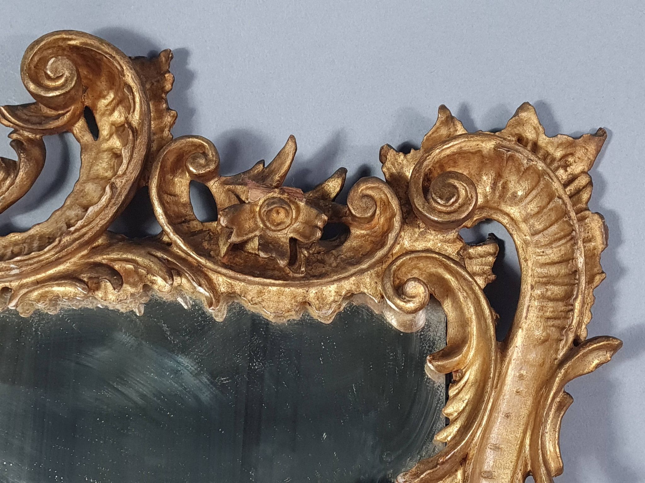 Mirror circa 1800, carved and gilded wooden frame, rocaille decoration, 54x39 cm, C227