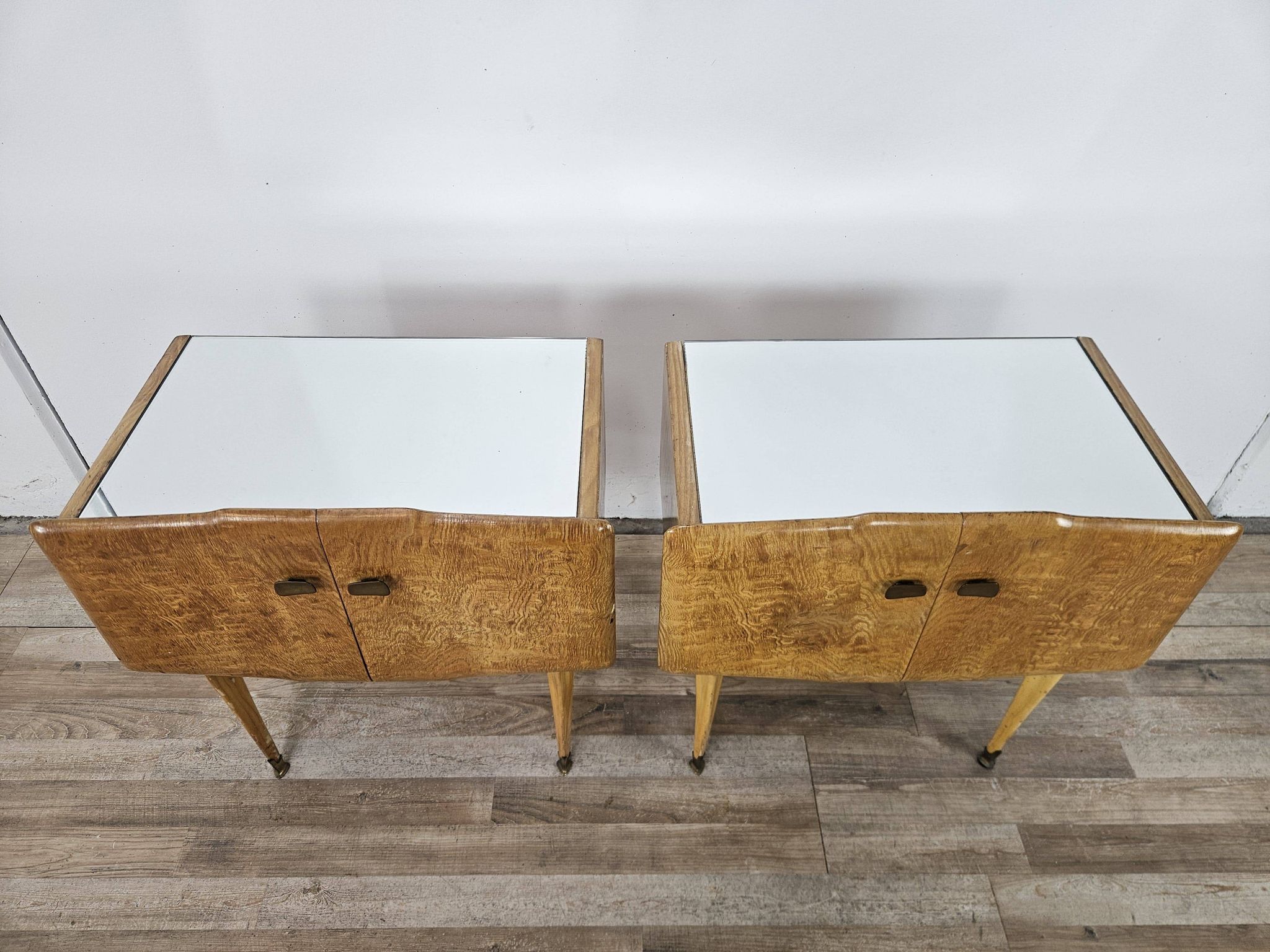 Pair of maple bedside tables from the 1950s with mirrored tops.