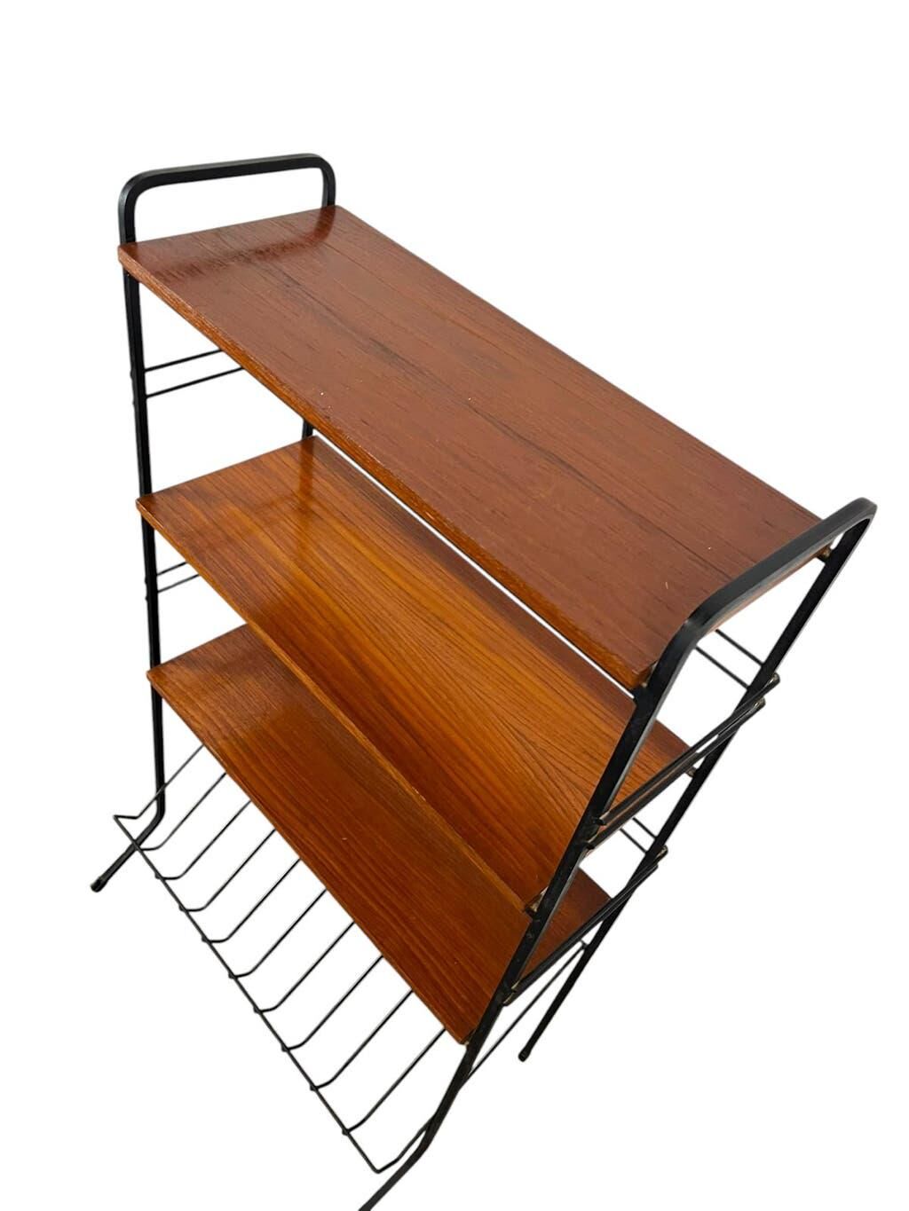 Vintage black shelf/coat rack with wooden accents.