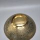 Engraved brass bowl from the mid-20th century with a scalloped edge.