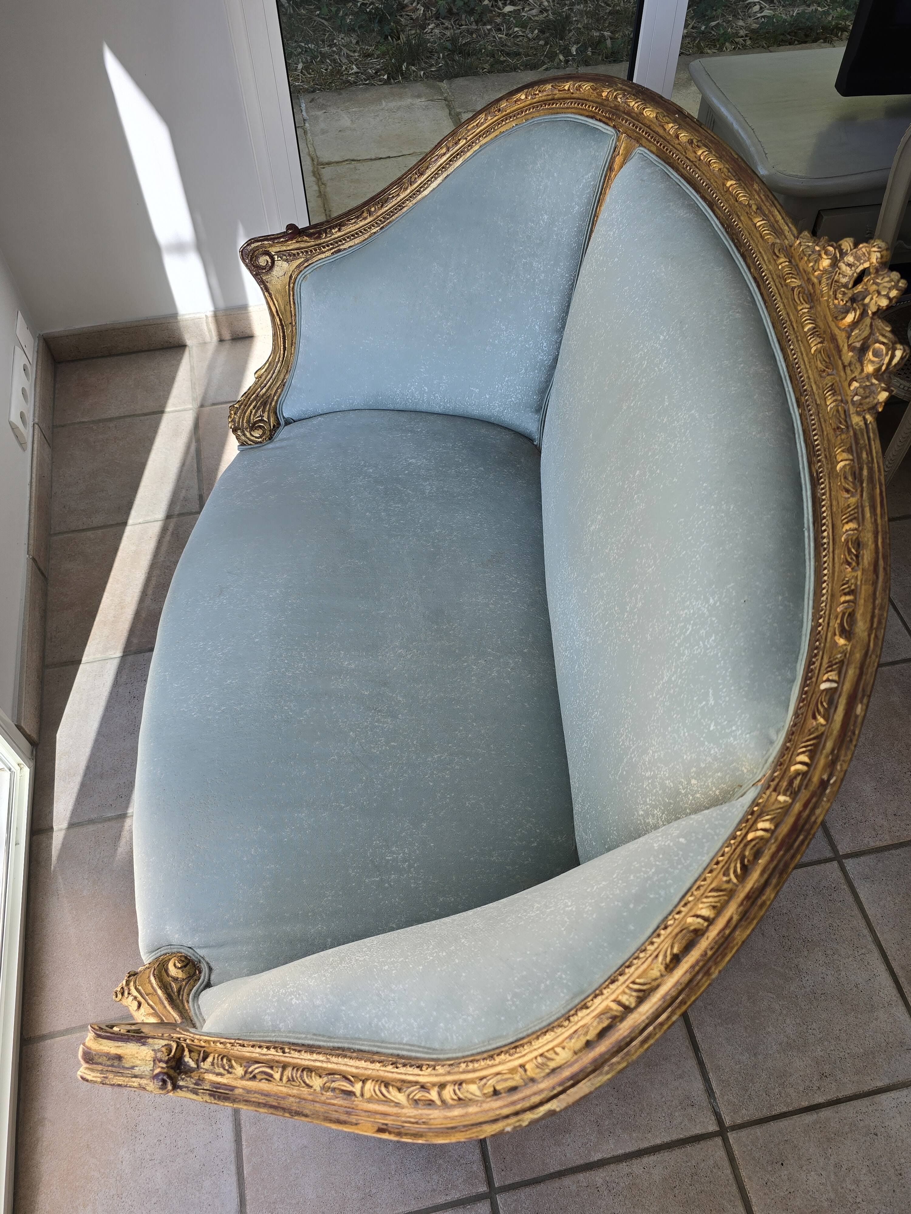Louis XV gilt basket canapé with green velvet.