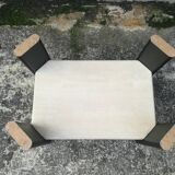 Low table in travertine and aluminium