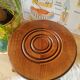 Low wood tripod stool turned countryside
