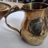 Small carved brass pourer