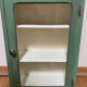 Small wooden cabinet patinated arsenic green
