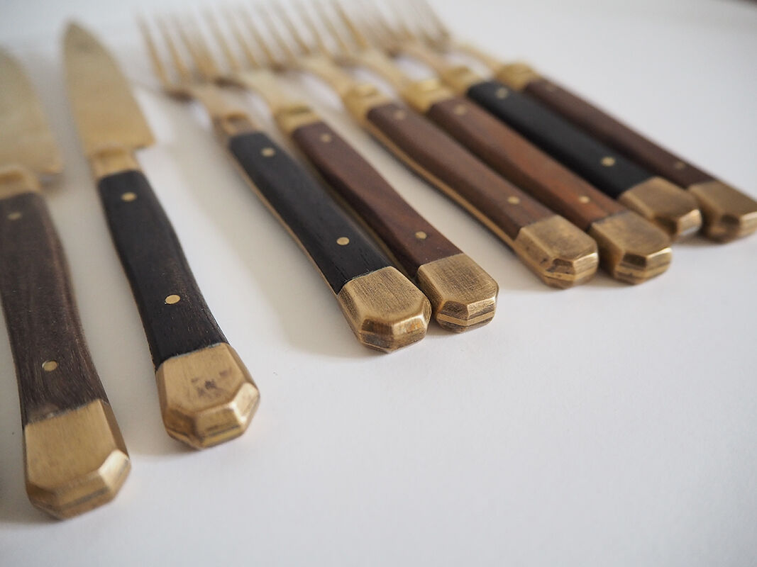 Set of old dessert cutlery in wood and brass