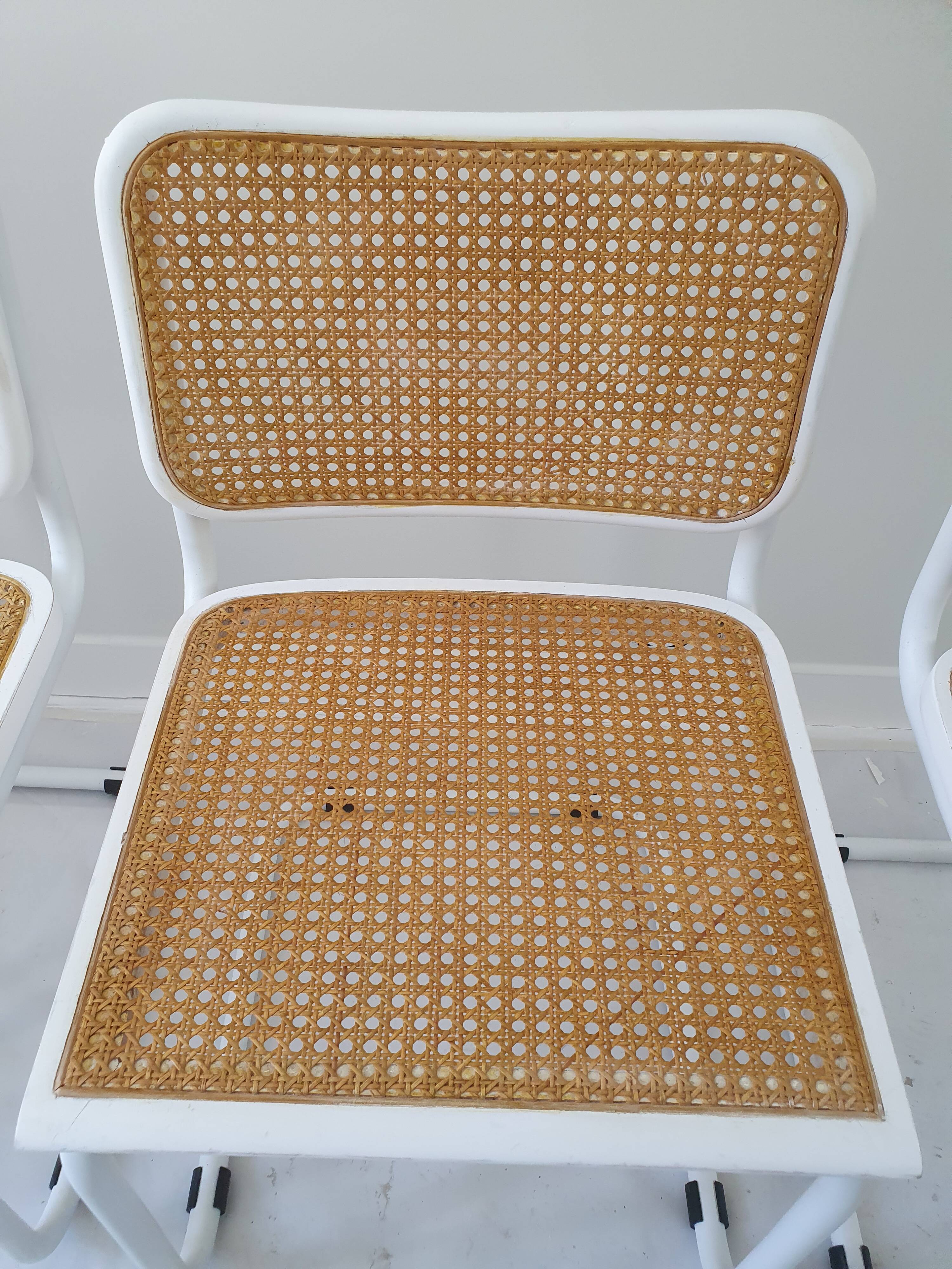 B32 chairs by Marcel Breuer in white.