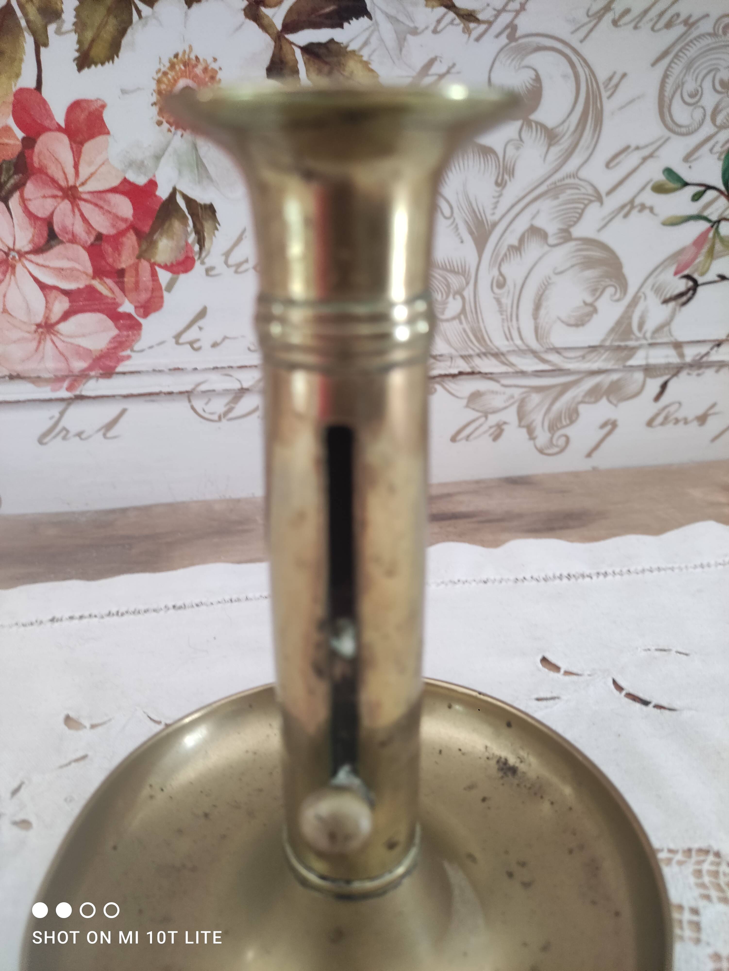 Brass push candle holder on frame