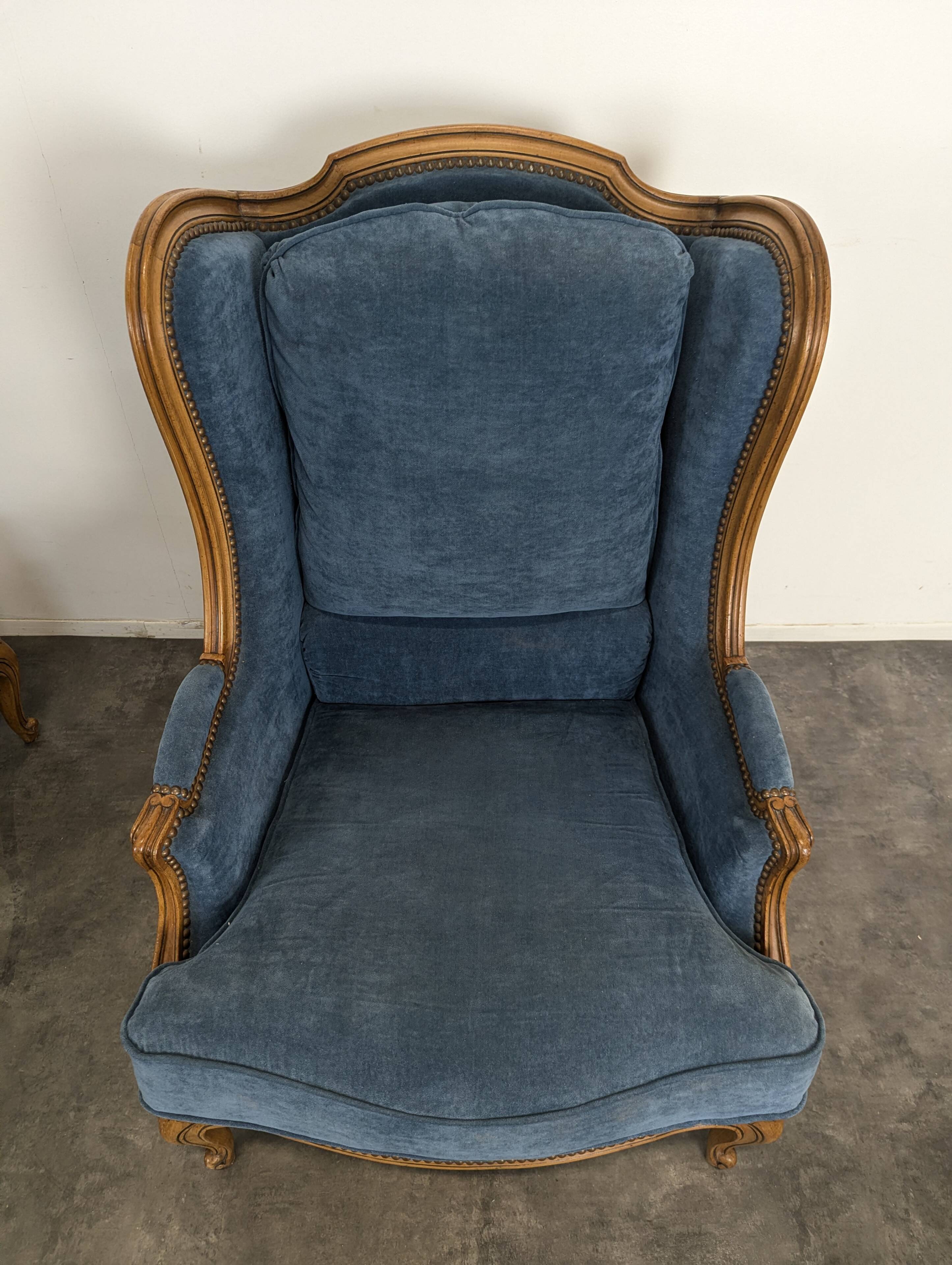 Pair of Louis XV style wingback armchairs in blue velvet.