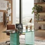 Solid glass desk with a half-moon top.