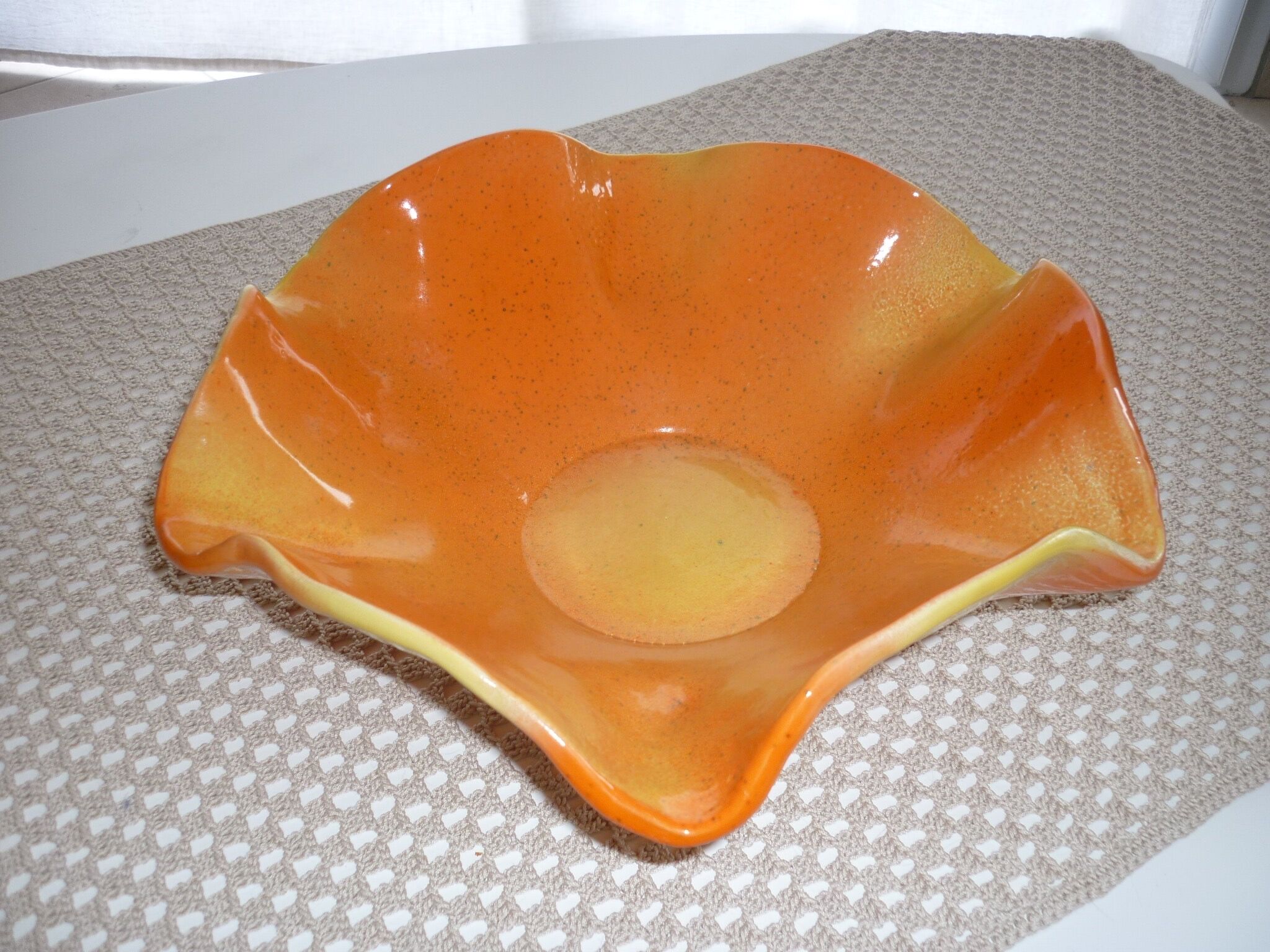Yellow and orange ceramic salad dish