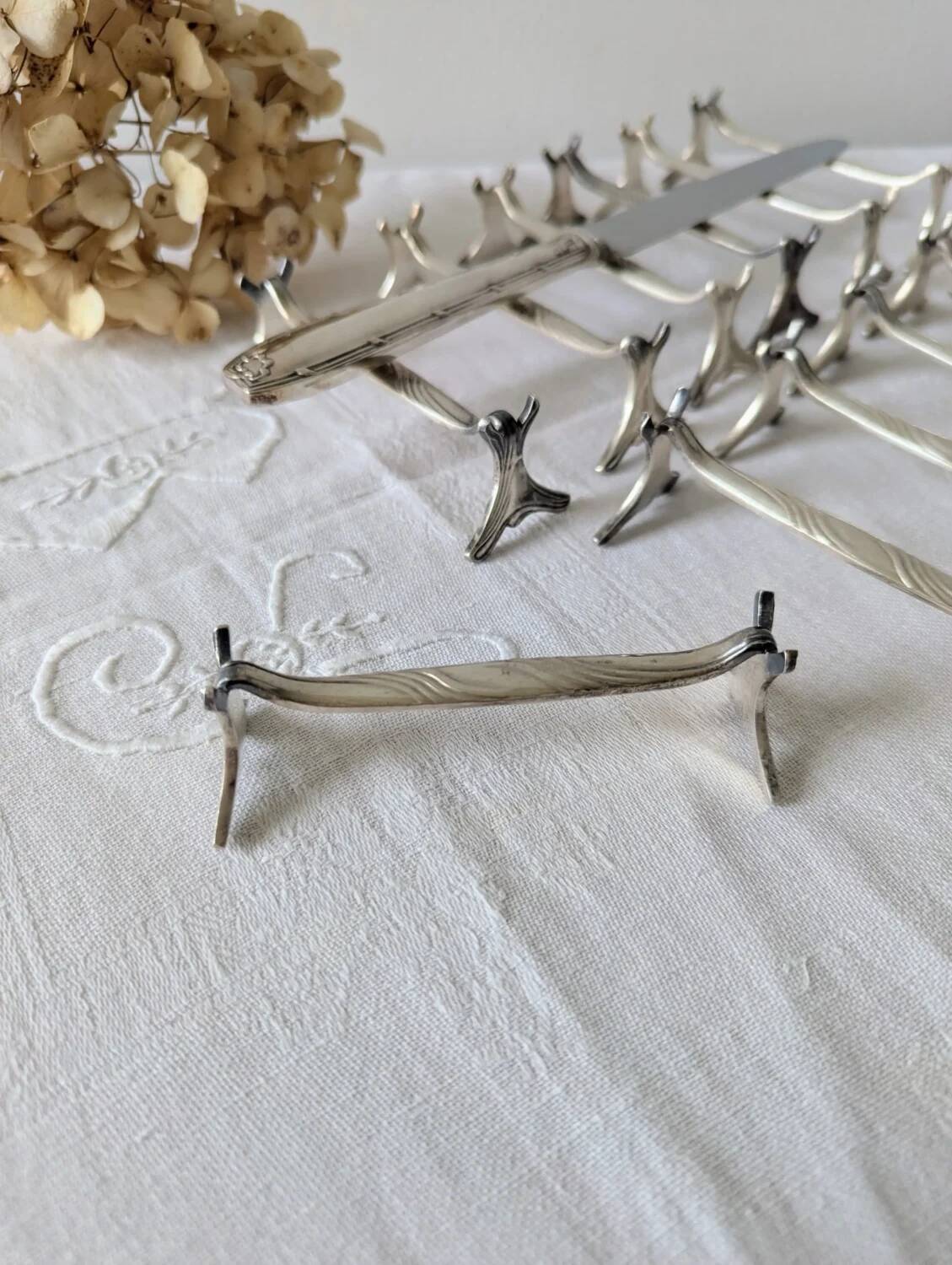Set of 12 Christofle knife rests, Moderne 1912 model