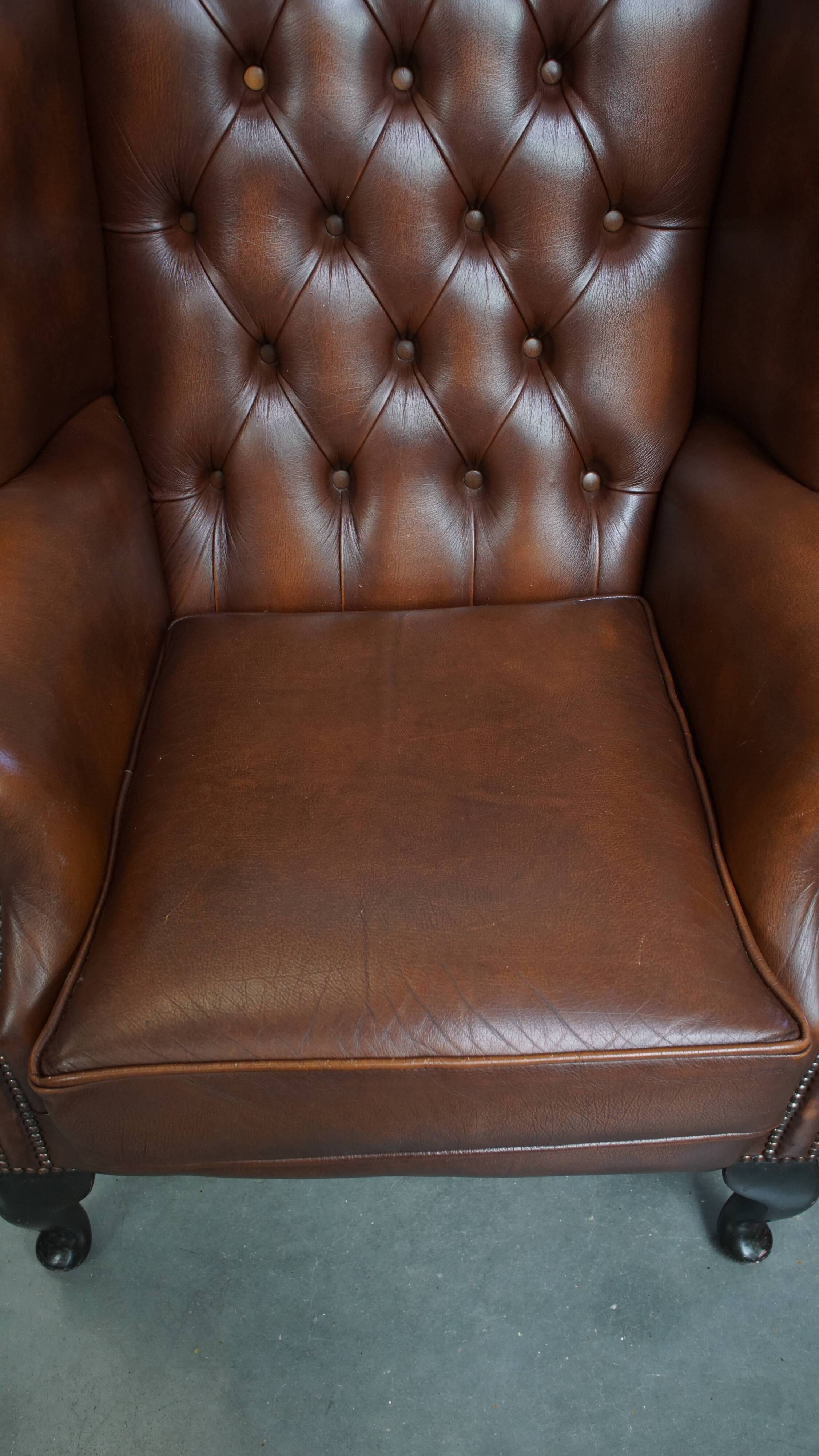 Chesterfield wing chair in dark brown English cowhide