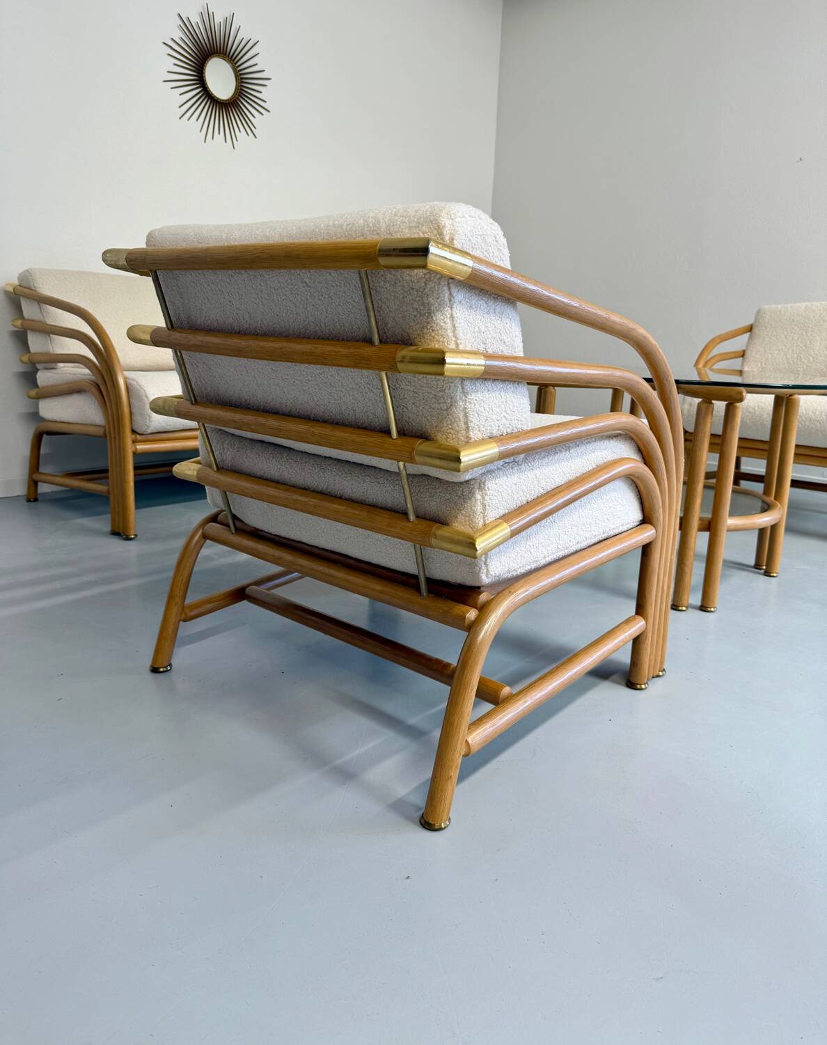 Complete living room with rattan sofa and white bouclette, brass finish, 80's design