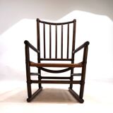 Manou rattan armchair with leather seat, 1960