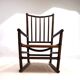 Fauteuil Manou en rotin et assise en cuir, 1960