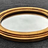 Oval mirror of 30 x 24 cm with its golden entourage of biedermeier