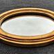 Oval mirror of 30 x 24 cm with its golden entourage of biedermeier