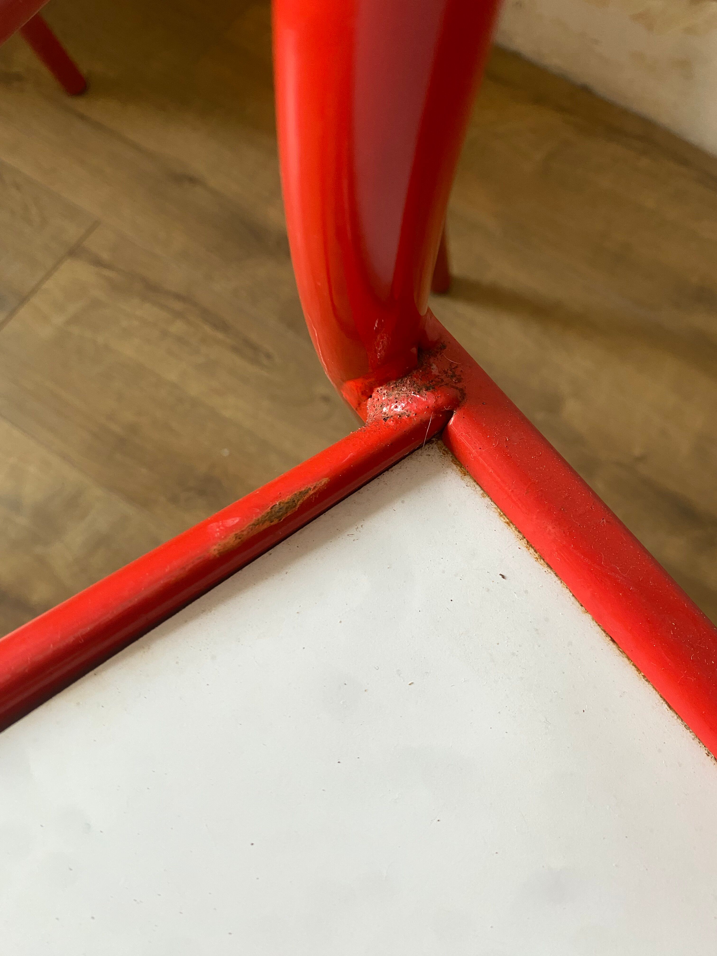 4 red metal chairs by Mallet-Stevens