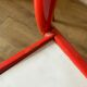 4 red metal chairs by Mallet-Stevens
