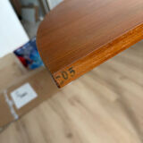 Vintage Scandinavian round table from the 50s and 60s in extendable teak with ra.