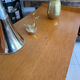 Vintage wooden and rattan chest of drawers with tapered legs.