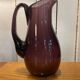 Plum colored glass pitcher