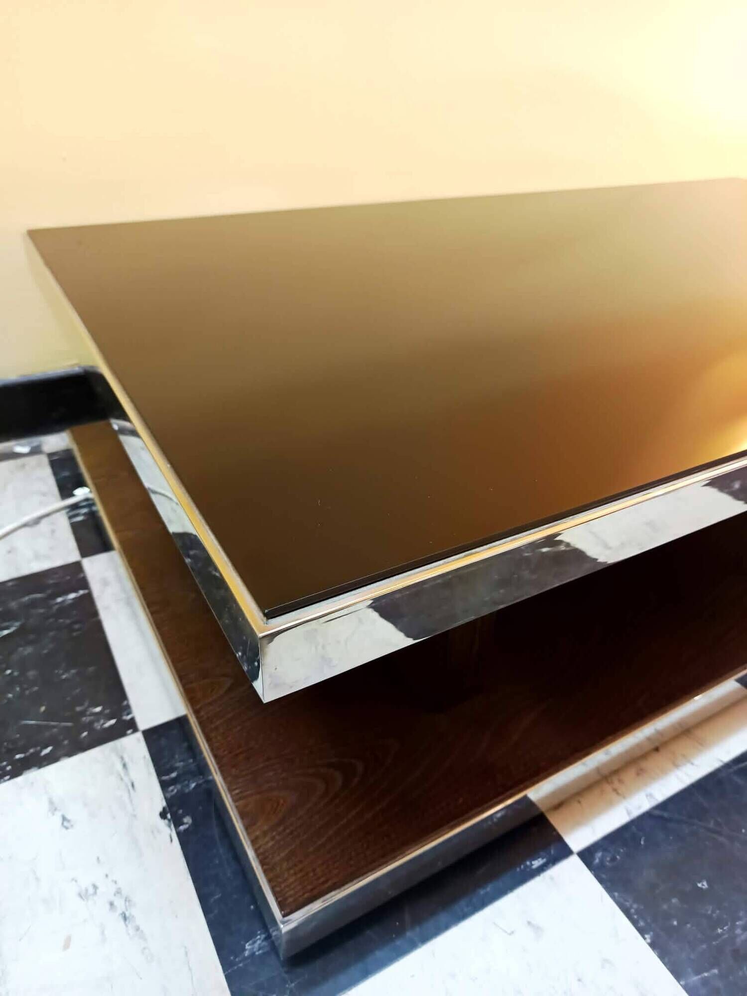Designer coffee table in glass and chrome metal.