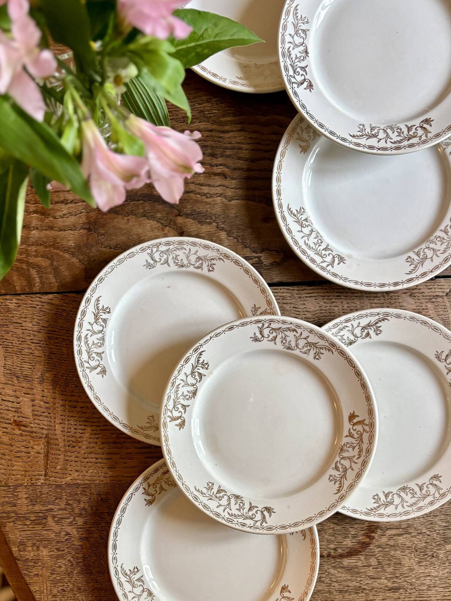 Set of 8 vintage white and gold dessert plates.