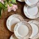 Set of 8 vintage white and gold dessert plates.
