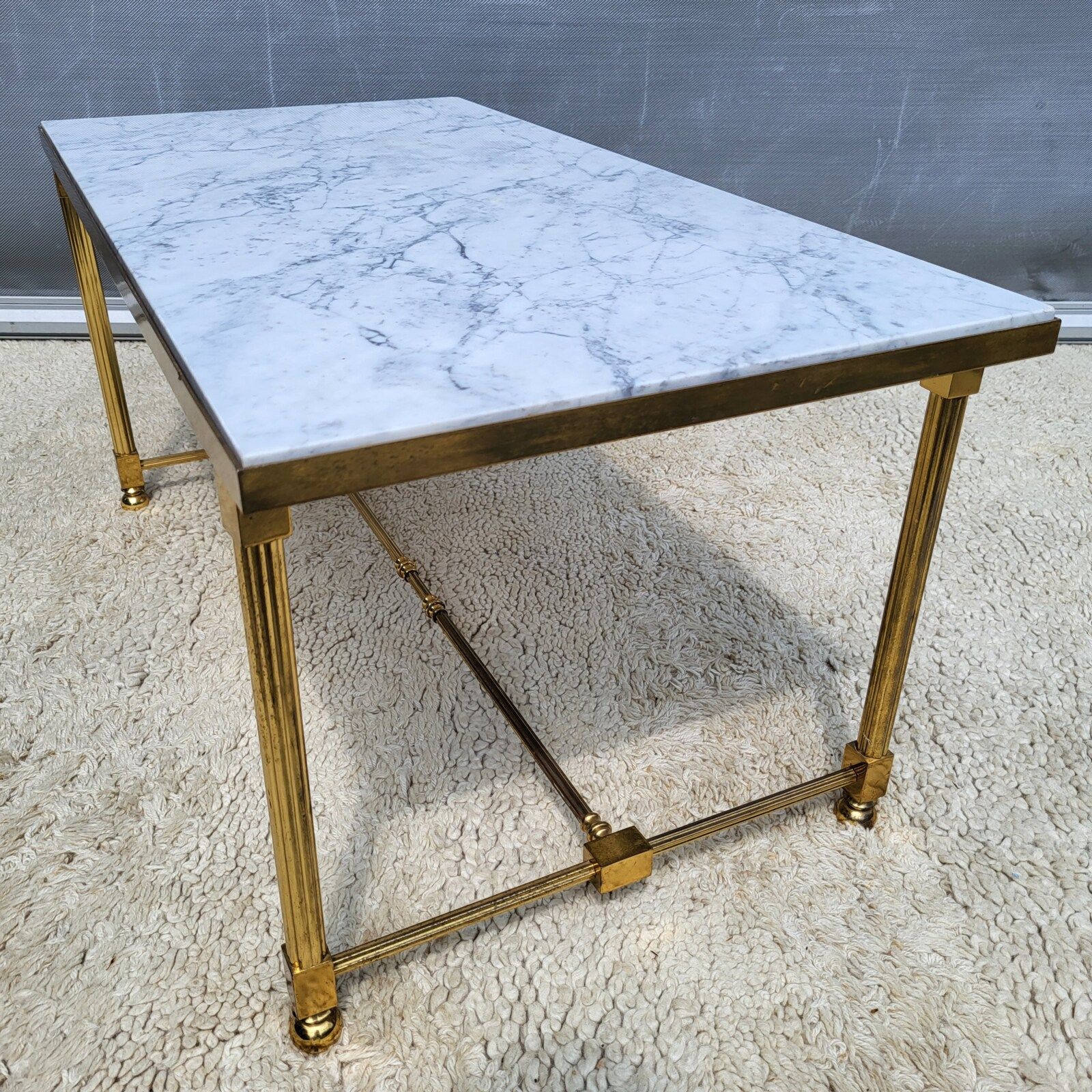 Hollywood Regency style coffee table • marble and brass