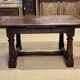 English monastery table with extensions from the late 19th century in elm and oak.
