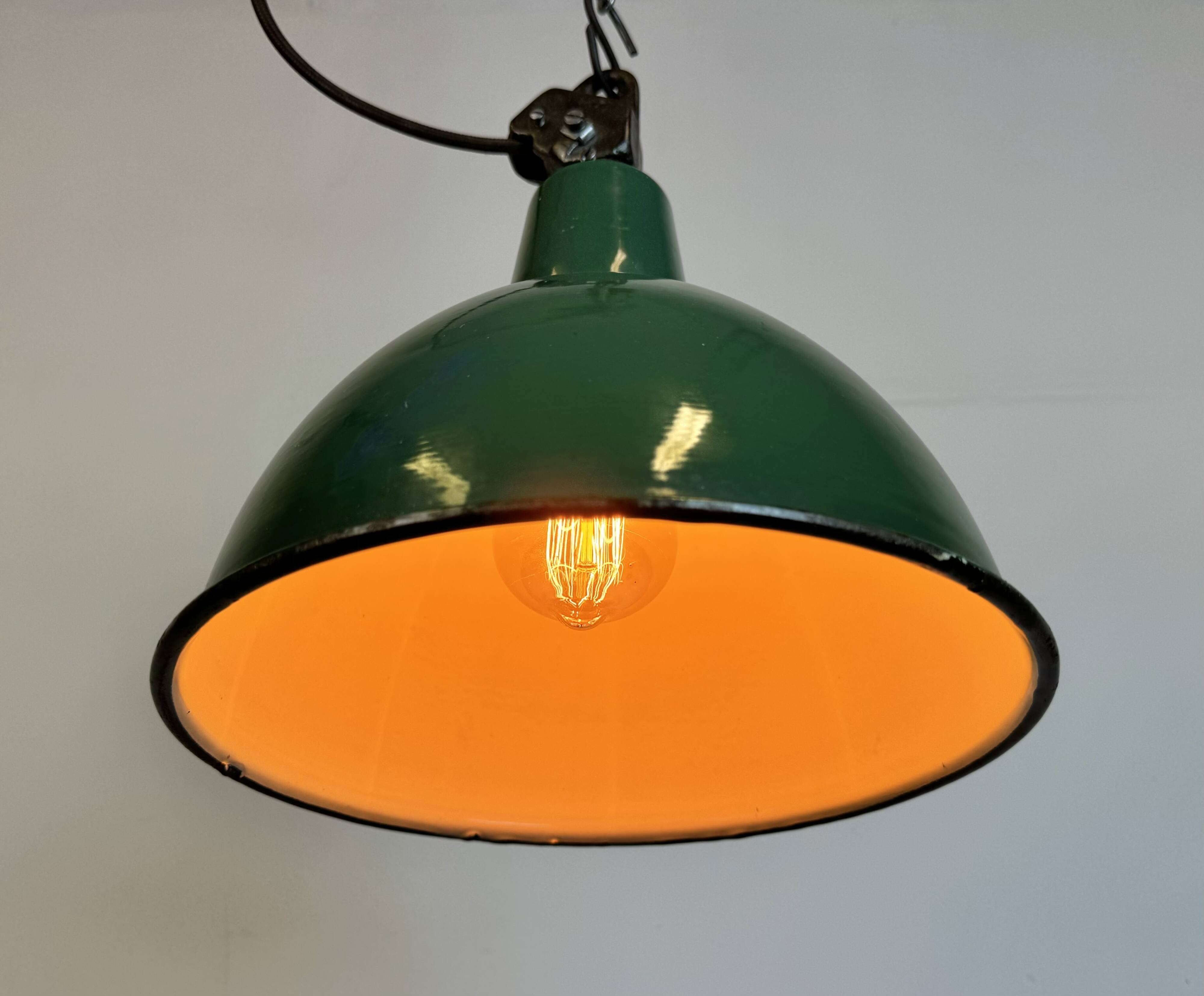 Industrial green enamel factory lamp with cast iron top, 1960s