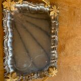 Silver metal top and decoration of foliage and handles in vintage brass